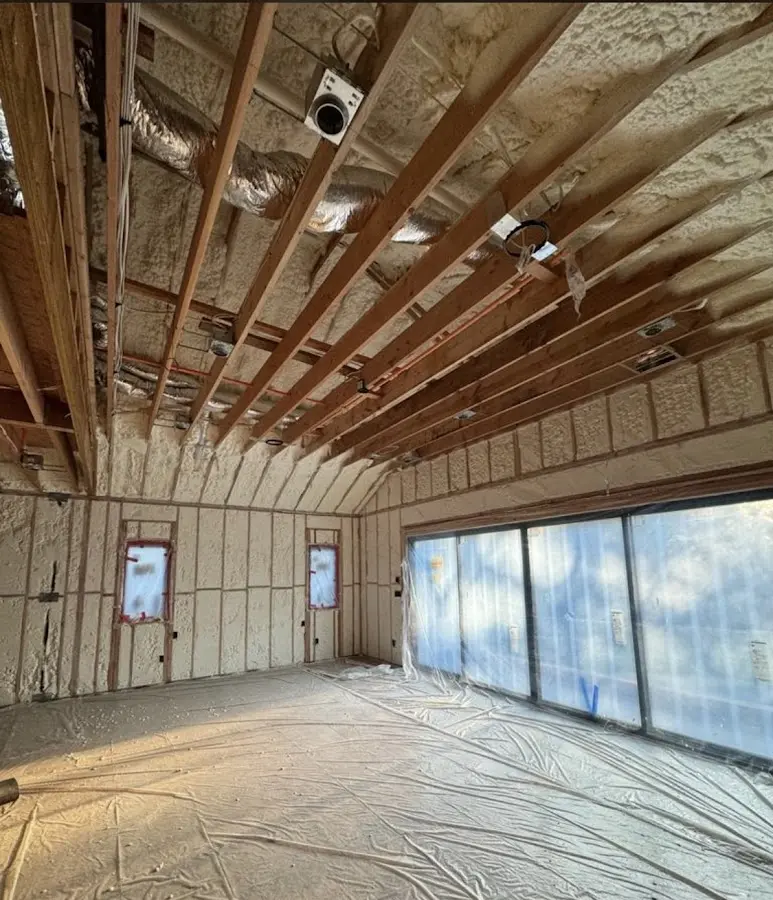 Interior walls and ceiling insulated with spray foam during new construction in Bristol